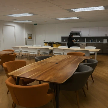 Clean conference room with wooden table