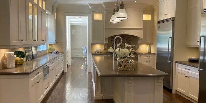 Clean kitchen with island and polished floors