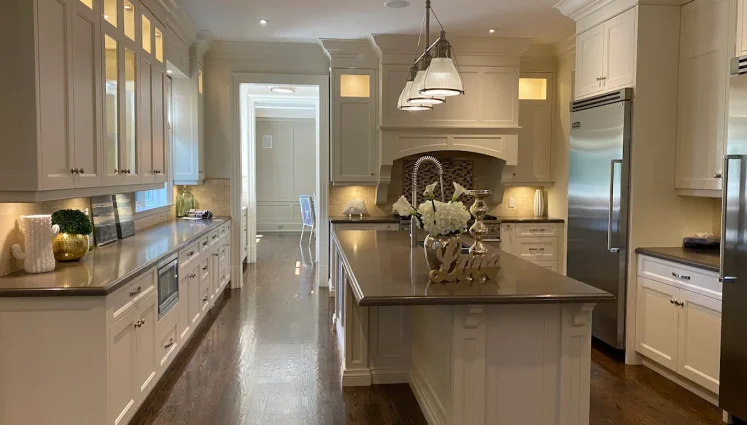 Clean kitchen with island and polished floors
